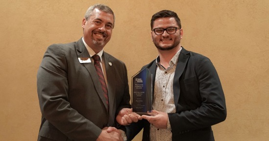 Clay Jordan (right) receives the 2024 Distinguished Alumni Award from Mid-Plains Community College President Ryan Purdy during the Nov. 3 Nebraska Community College Association’s annual meeting in Norfolk, Neb.